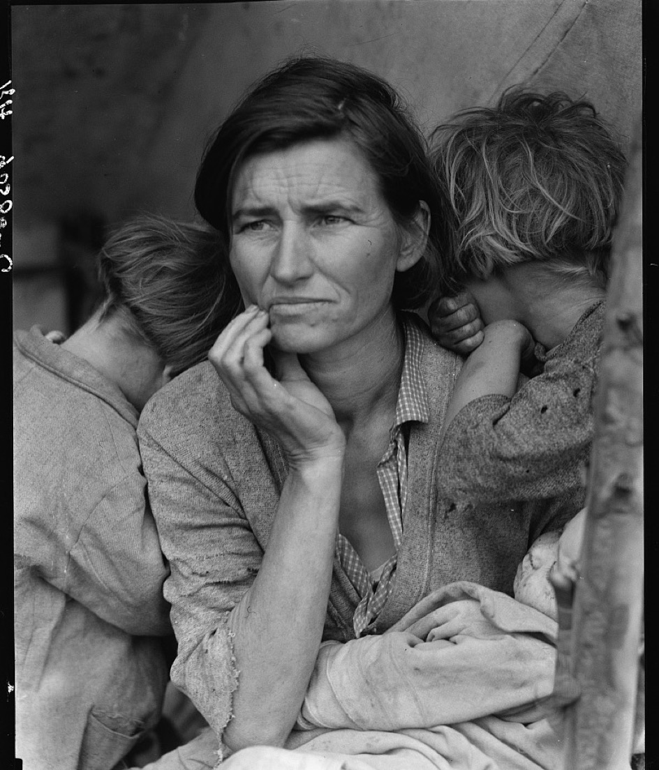 A damaged 1936 black-and-white photograph before restoration